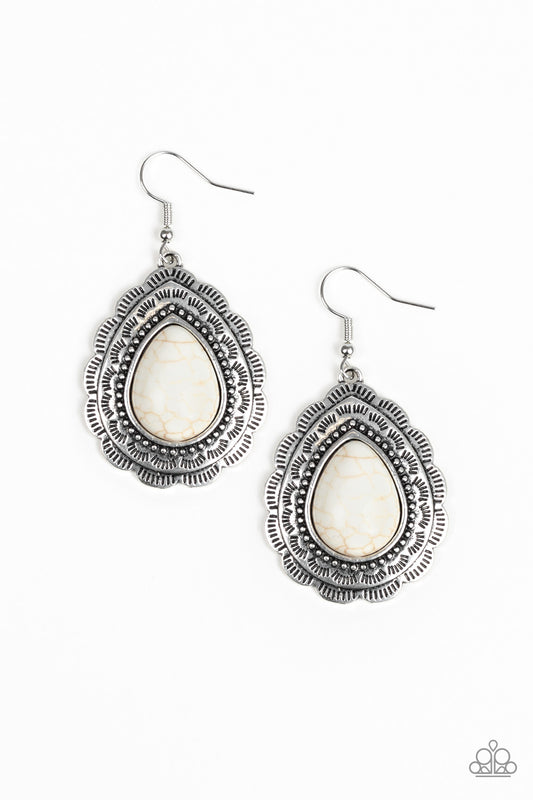 Chiseled into a tranquil teardrop, a refreshing white stone is pressed into a scalloped silver frame radiating with tribal inspired patterns for a seasonal look. Earring attaches to a standard fishhook fitting.  Sold as one pair of earrings.