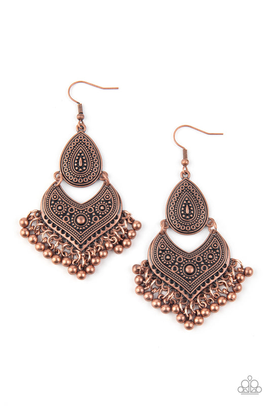 Studded and embossed in tribal inspired patterns, an antiqued copper teardrop links with a decorative copper frame. Dainty copper beads swing from the bottom of the stacked lure, creating a musical fringe. Earring attaches to a standard fishhook fitting.  Sold as one pair of earrings.