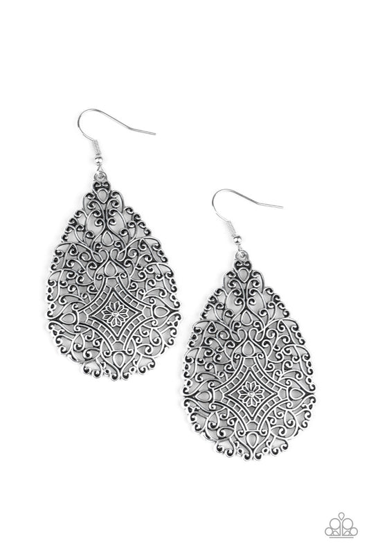 Brushed in an antiqued finish, burnished silver filigree climbs into a floral teardrop frame for a whimsically vintage look. Earring attaches to a standard fishhook fitting.  Sold as one pair of earrings.