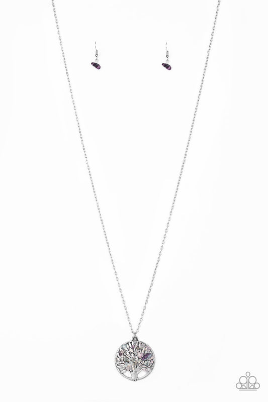 Bits of multicolored rock are sprinkled along a shimmery silver tree pendant, creating colorful leaves. As the stone elements in this piece are natural, some slight color variation is normal. Features an adjustable clasp closure.  Sold as one individual necklace. Includes one pair of matching earrings.