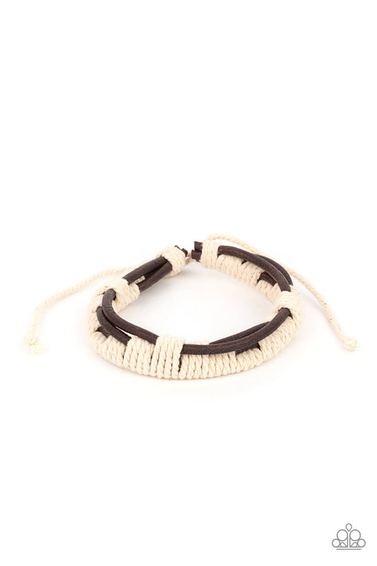 Rustic white cording sporadically knot around three leathery brown cords, creating a rustic display around the wrist. Features an adjustable sliding knot closure.  Sold as one individual bracelet.