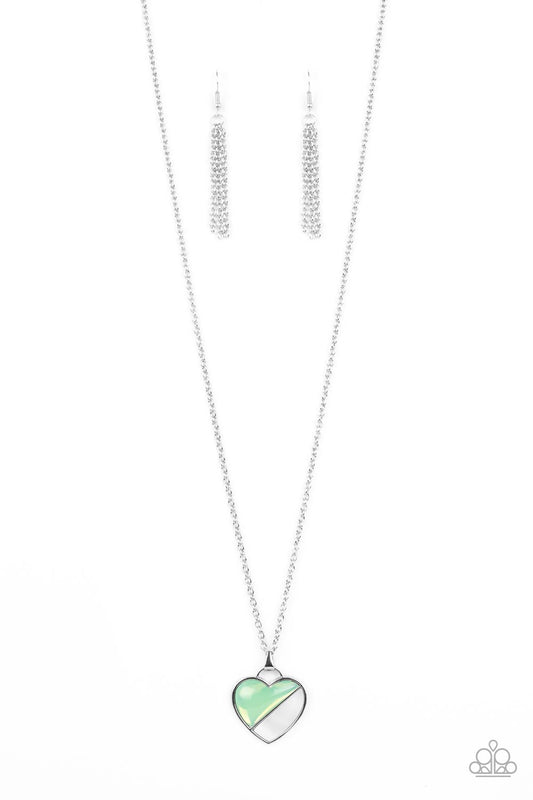 Encased in a silver heart frame, a glassy green bead and white shell-like stone lay side-by-side, creating a romantic pendant at the bottom of a classic silver chain. Features an adjustable clasp closure.  Sold as one individual necklace. Includes one pair of matching earrings.
