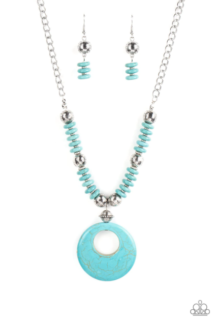 Infused with dainty silver accents, mismatched silver beads and turquoise stone discs are threaded along an invisible wire below the collar. An oversized turquoise stone pendant swings from the center of the earthy strand, creating a bold pop of seasonal inspiration. Features an adjustable clasp closure.  Sold as one individual necklace. Includes one pair of matching earrings.