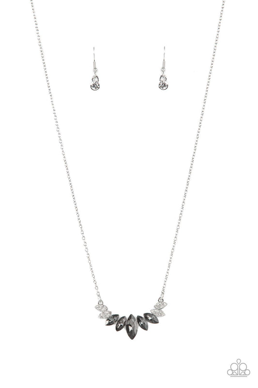 A fan of smoky marquise cut rhinestones is flanked by pairs of white rhinestone encrusted silver frames at the bottom of a dainty silver chain, resulting in a regal centerpiece below the collar. Features an adjustable clasp closure.  Sold as one individual necklace. Includes one pair of matching earrings.