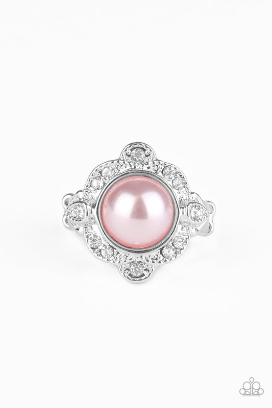 A pearly pink bead is pressed into the center of an ornate silver frame dotted in glassy white rhinestones, creating a refined statement piece atop the finger. Features a dainty stretchy band for a flexible fit.  Sold as one individual ring.