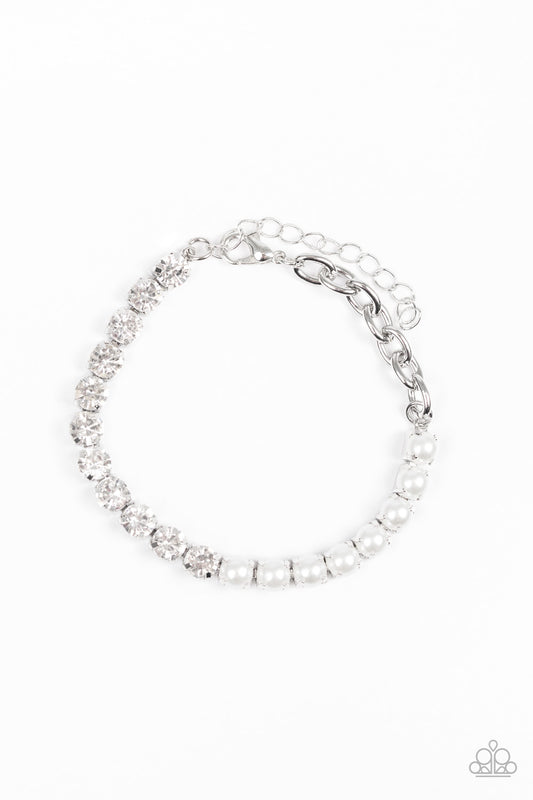 Featuring square silver fittings, a row of pearly white beads connect with a row of glittery white rhinestones for a modern twist. Features an adjustable clasp closure.  Sold as one individual bracelet.