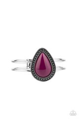 A shiny Magenta Purple teardrop bead is pressed into the center of a studded silver frame atop an airy silver cuff, creating a vibrant pop of color around the wrist. Features a hinged closure.

Sold as one individual bracelet.