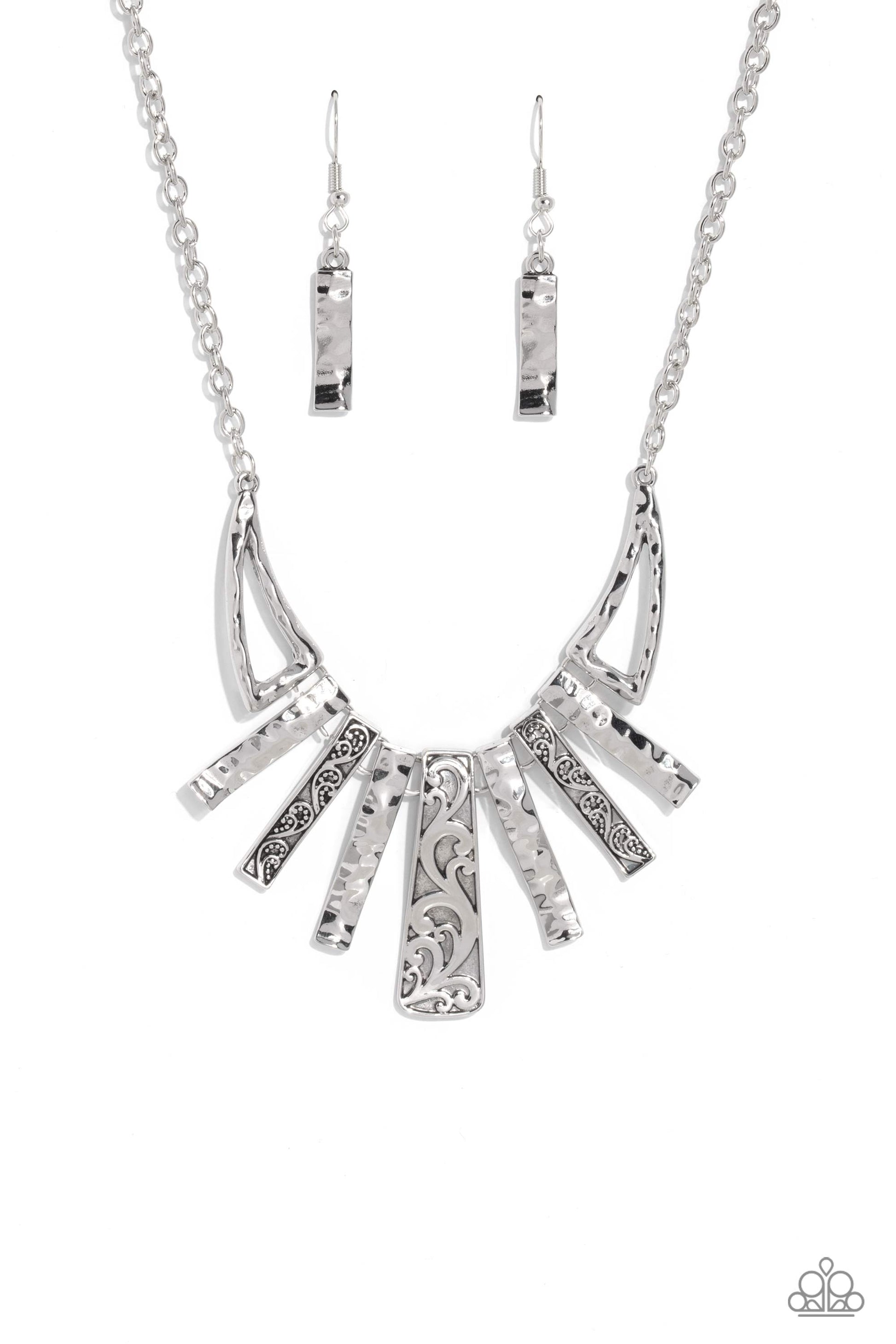 Streaming from a glittery silver chain, warped silver bars with a hammered sheen alternate between warped bars featuring an embossed paisley pattern for a garden statement. Abstract triangles, in the same hammered sheen border the abstract bar display for additional attention-drawing detail down the neckline. Features an adjustable clasp closure.  Sold as one individual necklace. Includes one pair of matching earrings.