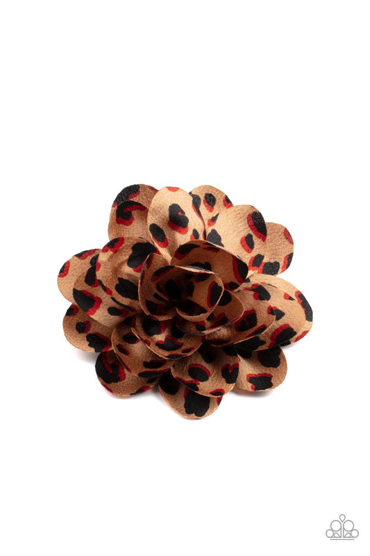 Featuring animal inspired print, colorfully spotted petals gather into a wildly wonderful blossom. Features a standard hair clip on the back.  Sold as one individual hair clip.