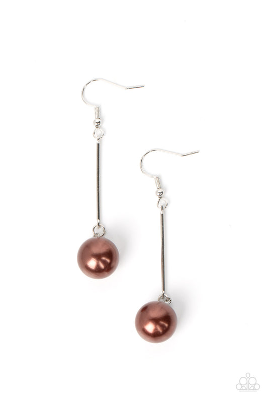 An oversized brown pearl delicately links to the bottom of a sleek silver rod, adding a timeless twist to the classic pearl palette. Earring attaches to a standard fishhook fitting.  Sold as one pair of earrings.