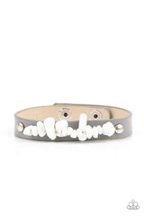 A strand of white pebbles is studded in place across the front of a skinny gray leather band, creating a colorful earthy display around the wrist. Features an adjustable snap closure.  Sold as one individual bracelet.