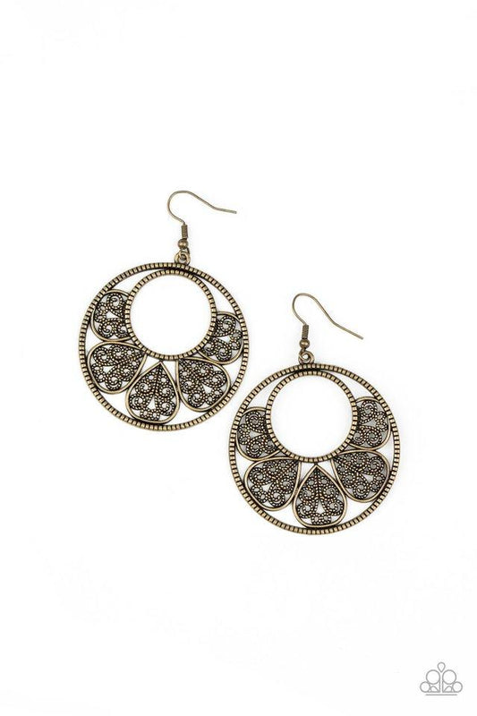 Filigree filled petals fan out from the bottom of a textured brass ring, coalescing into a whimsical floral hoop. Earring attaches to a standard fishhook fitting.  Sold as one pair of earrings.