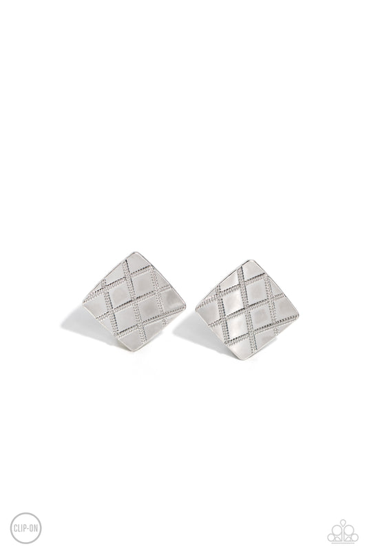 A curving silver square is embossed in a slanted plaid-like pattern, creating a tactile frame. Earring attaches to a standard clip-on fitting.  Sold as one pair of clip-on earrings.
