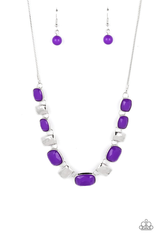 Rounded rectangular beads in a vibrant purple hue are pressed into silver frames, showcasing their faceted surfaces as they crawl along the collar. Small rectangular plates, hammered in subtle texture, shimmer in between the purple beads, adding funky metallic accents to the design. Features an adjustable clasp closure.  Sold as one individual necklace. Includes one pair of matching earrings.