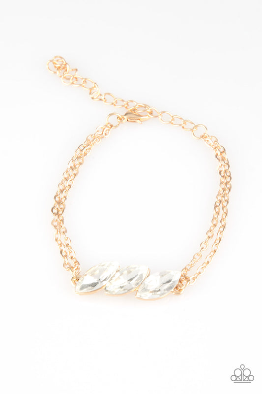 Featuring regal marquise-cuts, a trio of glittery white rhinestones join across the center of the wrist for a timeless look. Features an adjustable clasp closure.

Sold as one individual bracelet.