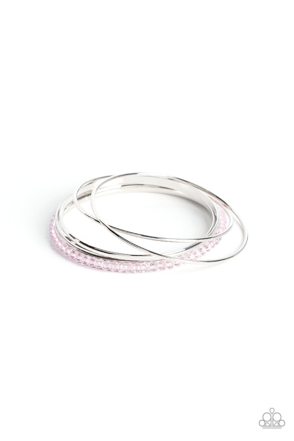 Pairs of dainty and flat silver bangles join a silver bangle adorned in Gossamer Pink crystal-like beads around the wrist, resulting in a stackable shimmer.  Sold as one set of five bracelets.