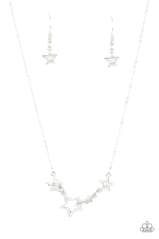 A mismatched collection of airy silver stars and white rhinestone dotted star frames delicately link below the collar, creating a stellar patriotic inspired pendant. Features an adjustable clasp closure.  Sold as one individual necklace. Includes one pair of matching earrings.
