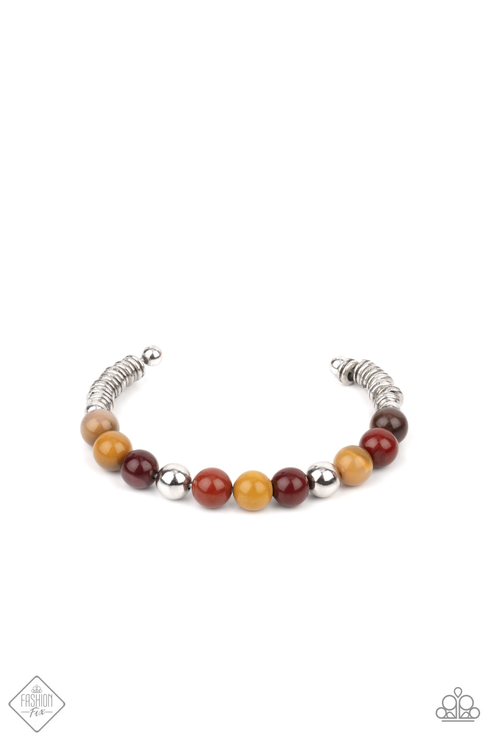 Accented with shiny silver beads, a collection of polished multicolored stone beads are fashioned into a wire cuff bracelet. The earthy stones give way on each end to a number of silver rings enclosed by small silver beads for a handmade inspired style.  Sold as one individual bracelet.