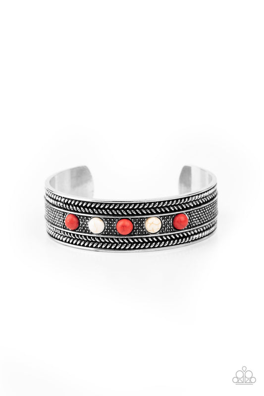 Dainty red and white stone beads are encrusted along the front of an ornate silver cuff studded and embossed in antiqued rope-like patterns.  Sold as one individual bracelet.