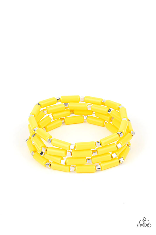 A playful collection of dainty silver cube beads and cylindrical Illuminating beads are threaded along stretchy bands, creating colorful layers around the wrist.  Sold as one set of four bracelets.
