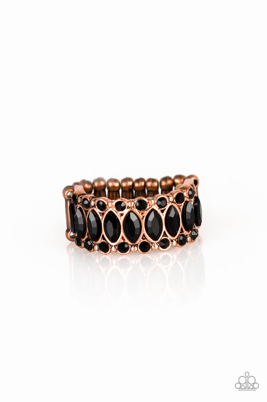 Featuring regal marquise style cuts, glittery black rhinestones are encrusted down the center of a copper band radiating with glassy black rhinestones for an edgy look. Features a stretchy band for a flexible fit.  Sold as one individual ring.