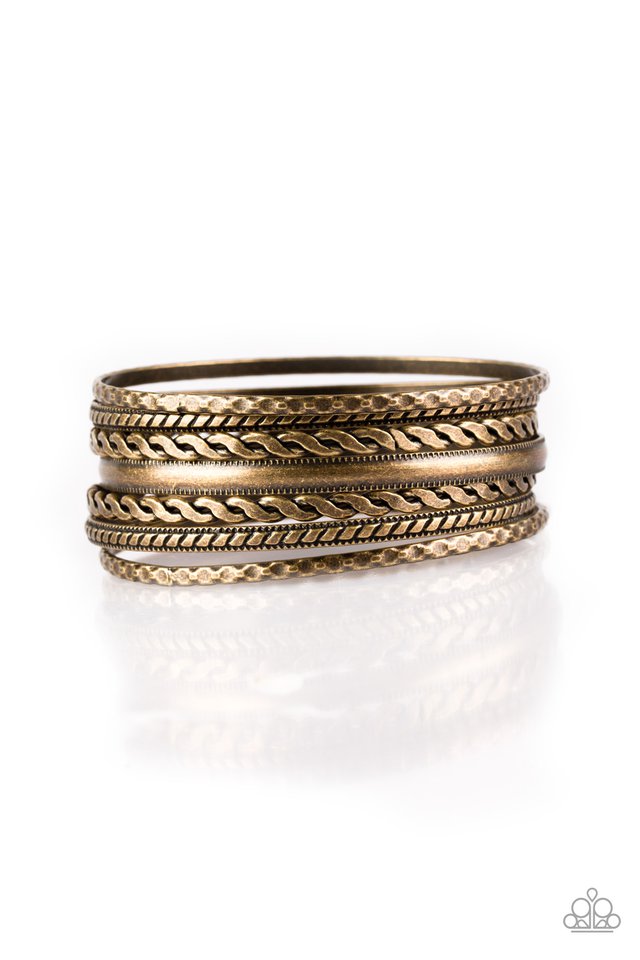 Featuring an array of tribal inspired textures, mismatched copper bangles stack across the wrist for a seasonal look.  Sold as one set of seven bracelets.