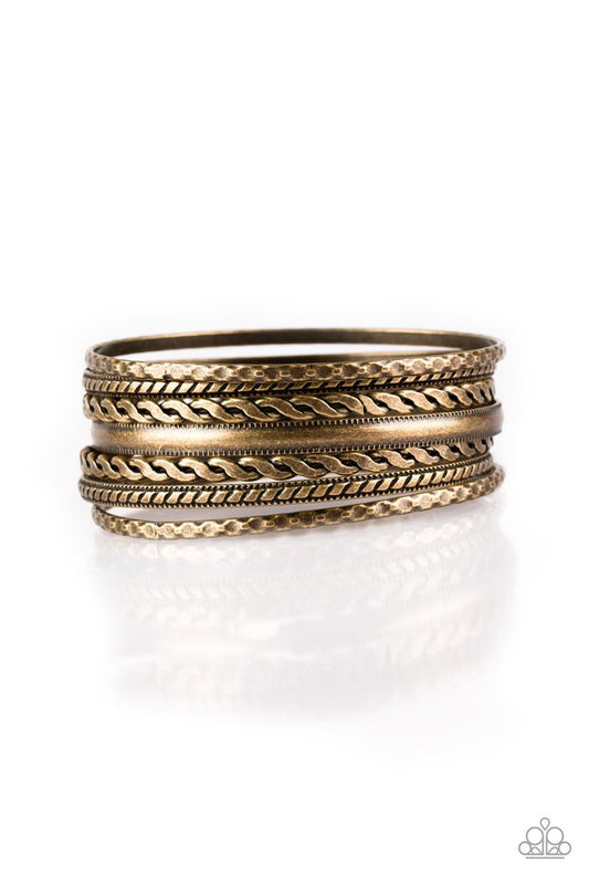 Featuring an array of tribal inspired textures, mismatched copper bangles stack across the wrist for a seasonal look.  Sold as one set of seven bracelets.
