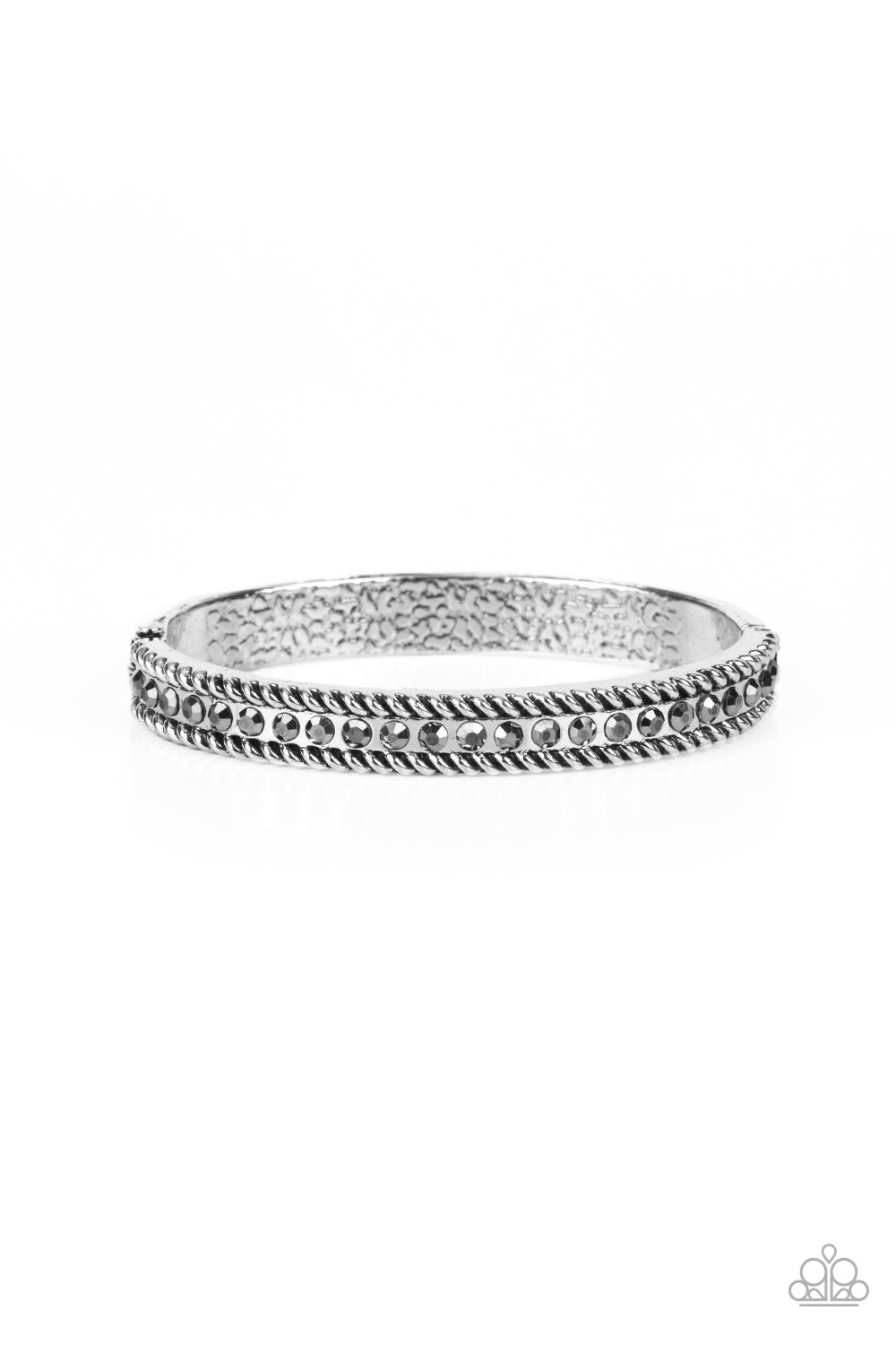 Gritty silver rope-like borders flank a glitzy row of hematite rhinestones, creating a smoldering bangle-like bracelet around the wrist. Features a hinged closure.  Sold as one individual bracelet.