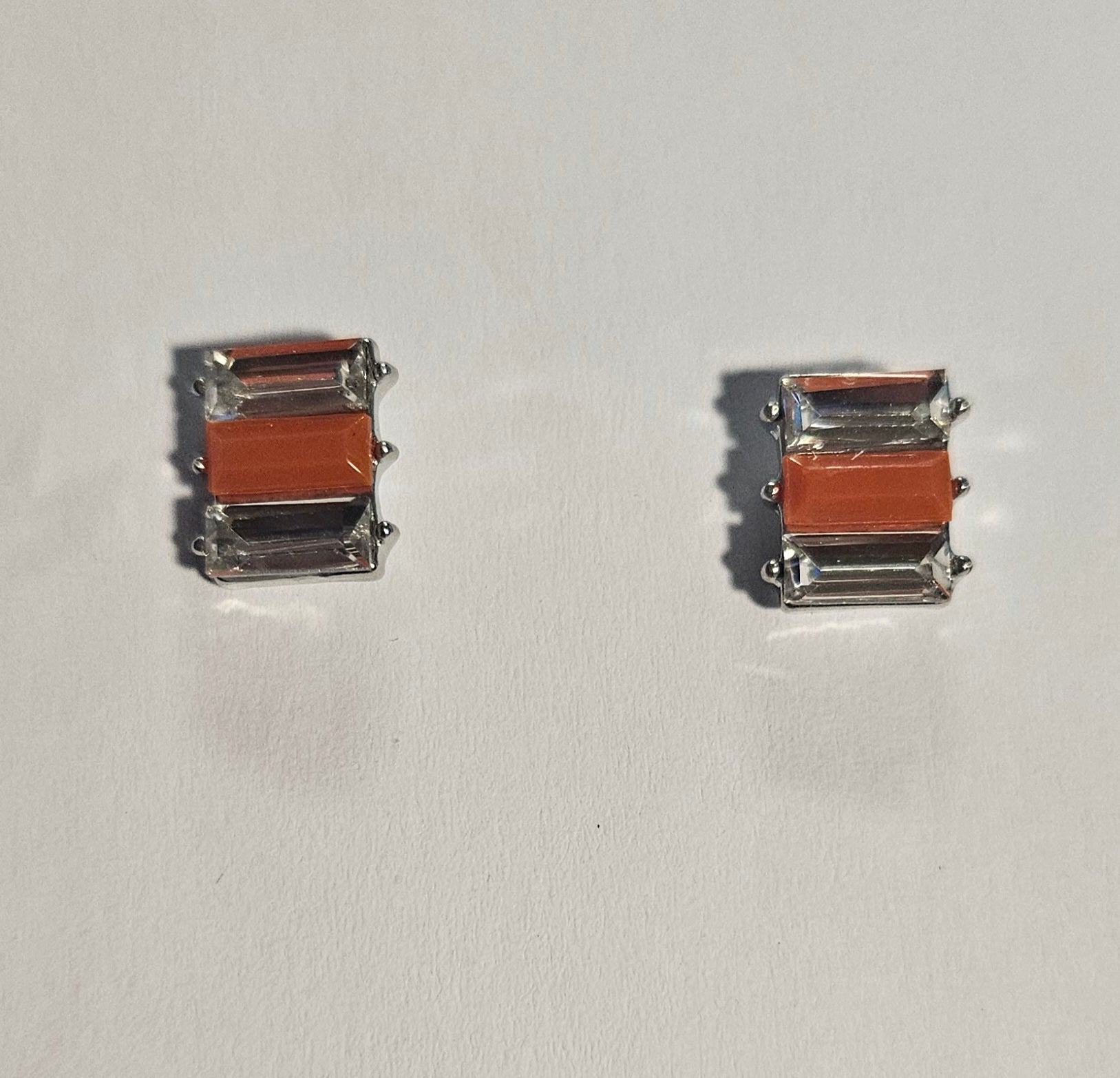Kids' rectangle earrings with orange rectangle bead in center and clear rectangle beads on each side
