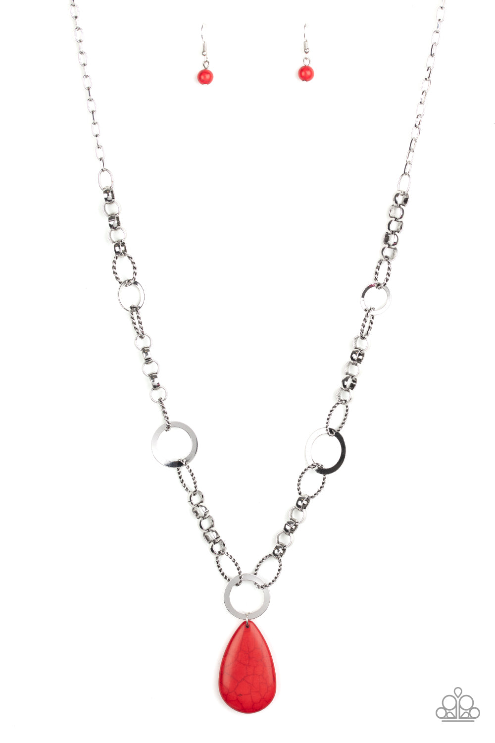 A mismatched collection of bold silver links, textured silver ovals, and flat silver rings connect down the chest, creating a unique chain. Chiseled into a tranquil teardrop, a refreshing red stone pendant swings from the bottom of the metallic compilation for an earthy finish. Features an adjustable clasp closure.  Sold as one individual necklace. Includes one pair of matching earrings.