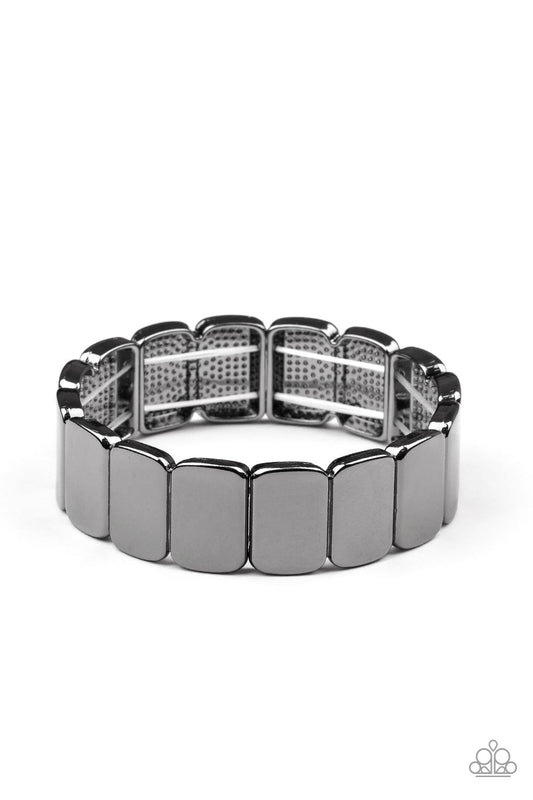 Brushed in a glistening shimmer, shiny gunmetal rectangular frames are threaded along stretchy bands around the wrist for a sleek industrial look.

Sold as one individual bracelet.