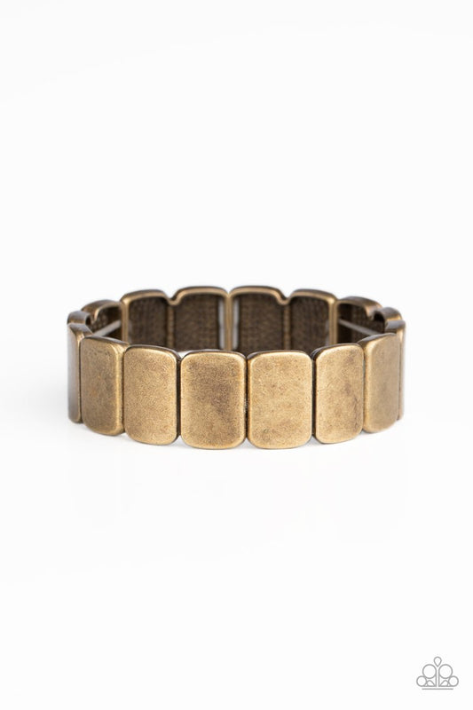 Brushed in an antiqued shimmer, burnished brass rectangular frames are threaded along stretchy bands around the wrist for a rustic look.

Sold as one individual bracelet.