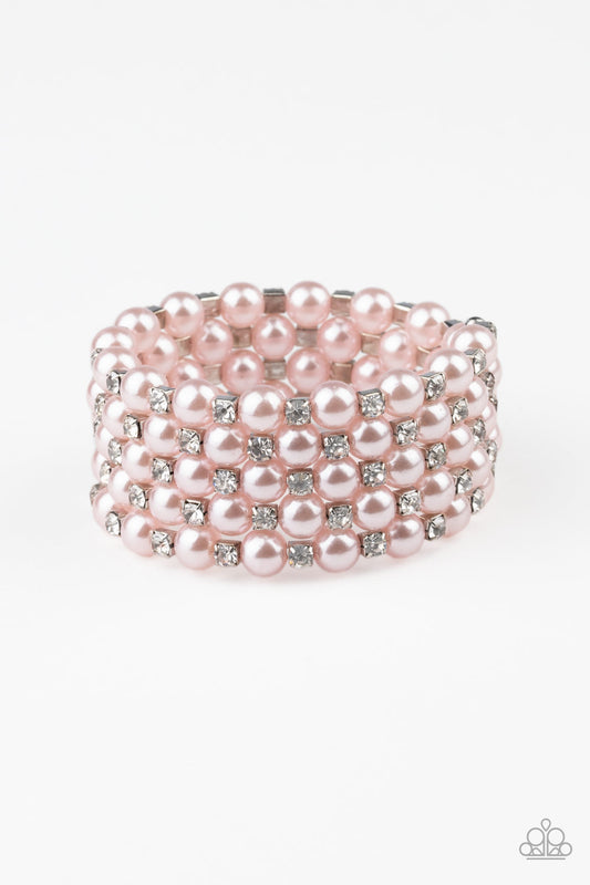 Bubbly pink pearls and classic white rhinestone encrusted silver frames are threaded along a coiled wire, creating a timeless infinity wrap style bracelet.  Sold as one individual bracelet.