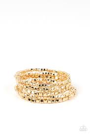 A dainty collection of glistening gold cube beads are threaded along stretchy bands around the wrist, creating edgy layers.

Sold as one set of four bracelets.