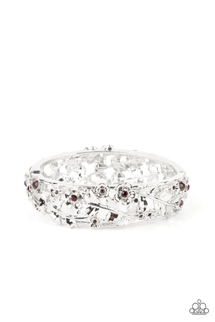 Dotted with dainty purple rhinestone centers, flowering leafy silver vines bloom into two oversized silver frames that delicately hinge into a versatile bangle-like bracelet. Features a hinged closure.  Sold as one individual bracelet.