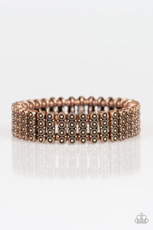 Dainty copper beads and stacked copper frames radiating with sunburst patterns are threaded along stretchy bands around the wrist for a whimsical look.

Sold as one individual bracelet.