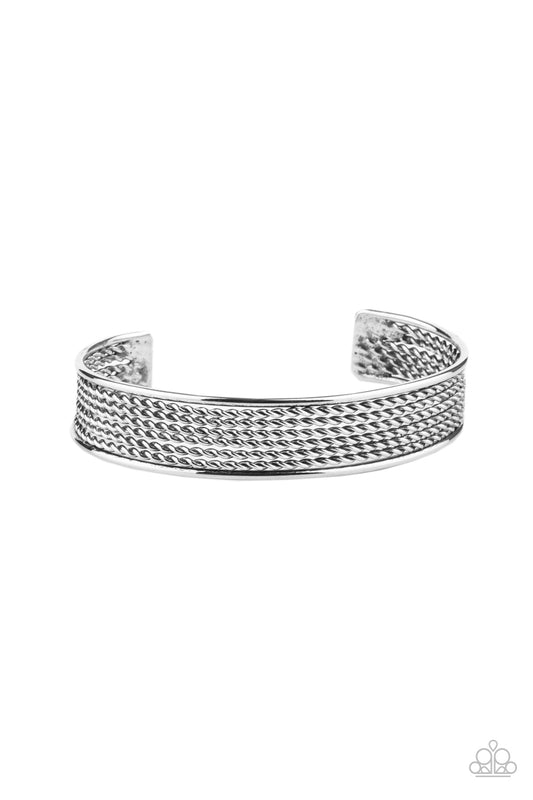 Sections of twisted silver wires are bordered by two smooth silver bars, coalescing into a bold industrial cuff around the wrist.  Sold as one individual bracelet.