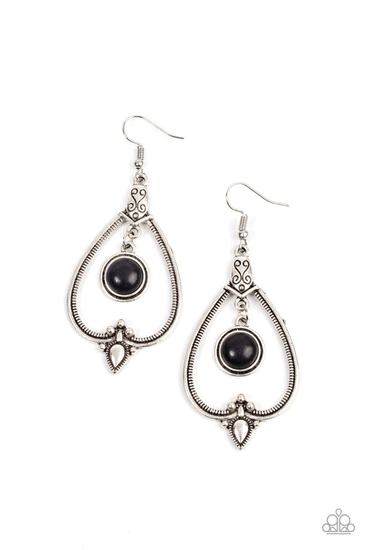An earthy black stone frame swings from the top of an ornately studded and textured silver teardrop frame, resulting in an earthy lure. Earring attaches to a standard fishhook fitting.  Sold as one pair of earrings.