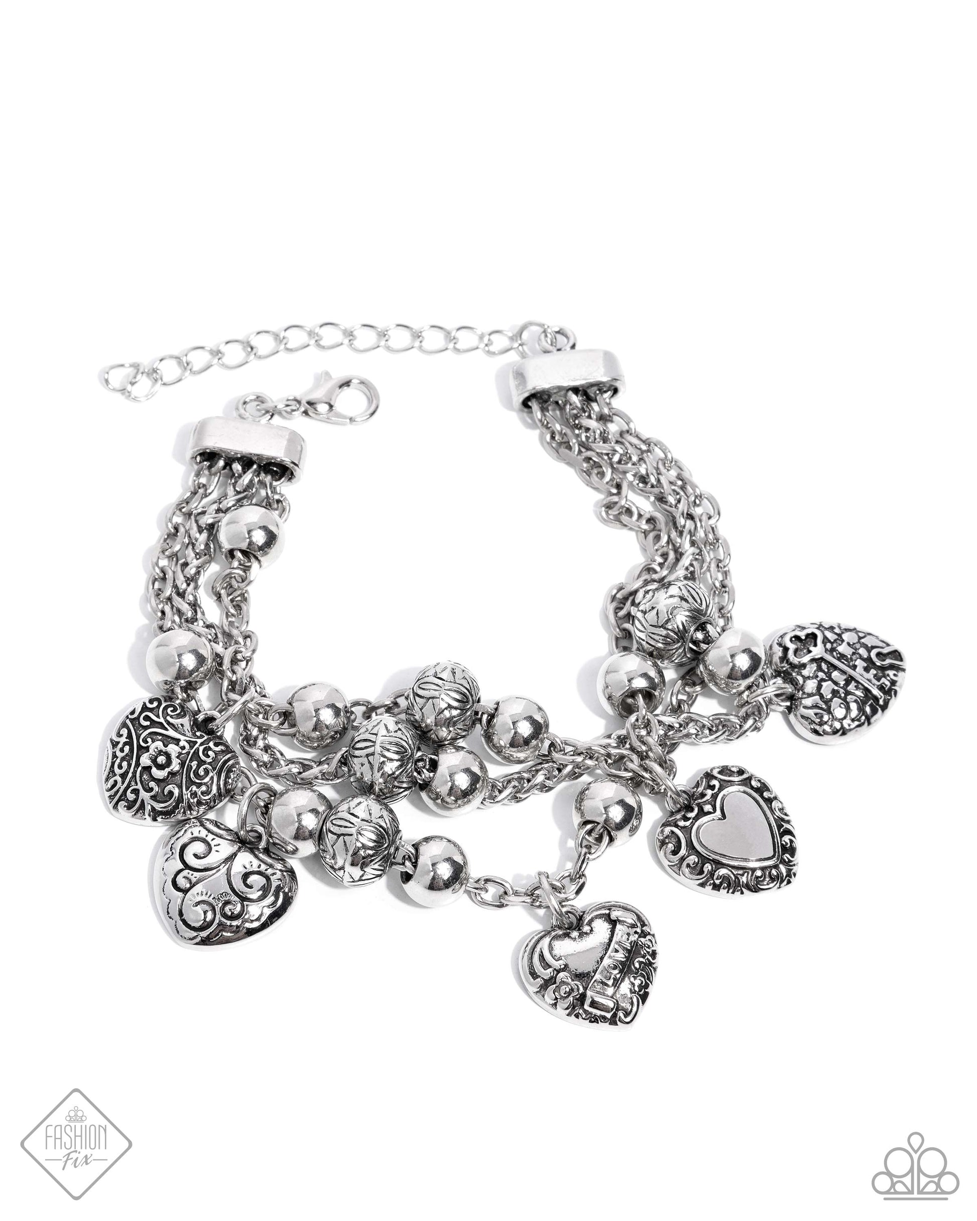 Spanning from silver fittings, a collection of classic silver chains spans around the wrist. Decorative floral and romantic-inspired filigree is embellished across a multitude of heart charms and silver beads while solid silver beads are also infused along the chains for a rustic, radiant display. Features an adjustable clasp closure.  Sold as one individual bracelet.