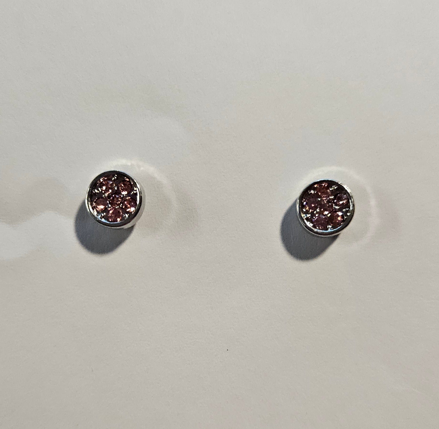 Kids' silver round earrings with multiple pink rhinestones