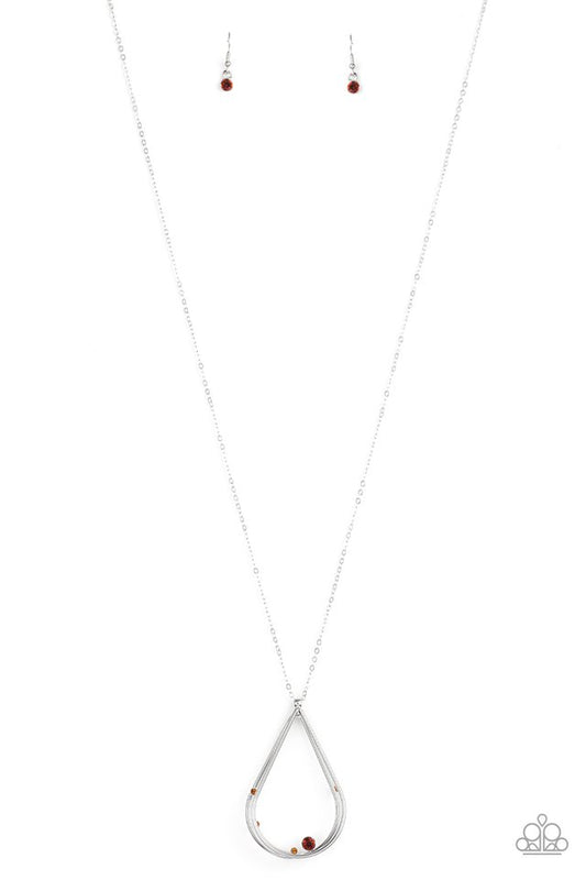Dainty topaz rhinestones collect at the bottom of a triple stacked silver teardrop, creating an elegantly refined pendant at the bottom of a lengthened silver chain. Features an adjustable clasp closure.  Sold as one individual necklace. Includes one pair of matching earrings.
