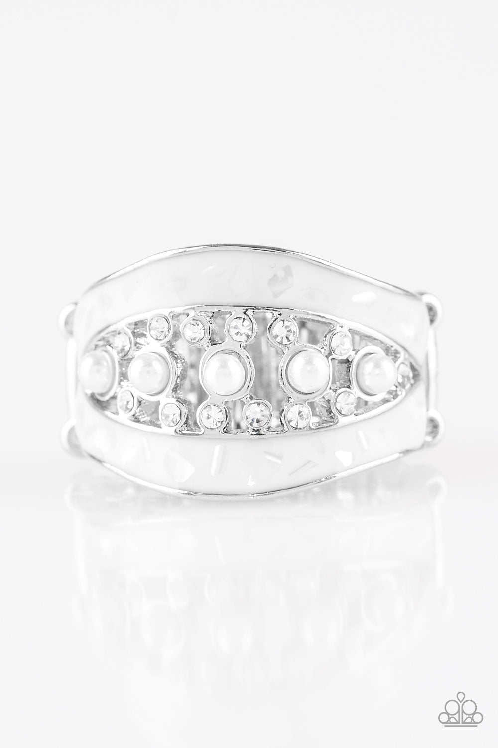Flecked in shell-like iridescence, shimmery white bands join around a bubbly pearl drop and white rhinestone center for a refined look. Features a stretchy band for a flexible fit.  Sold as one individual ring.