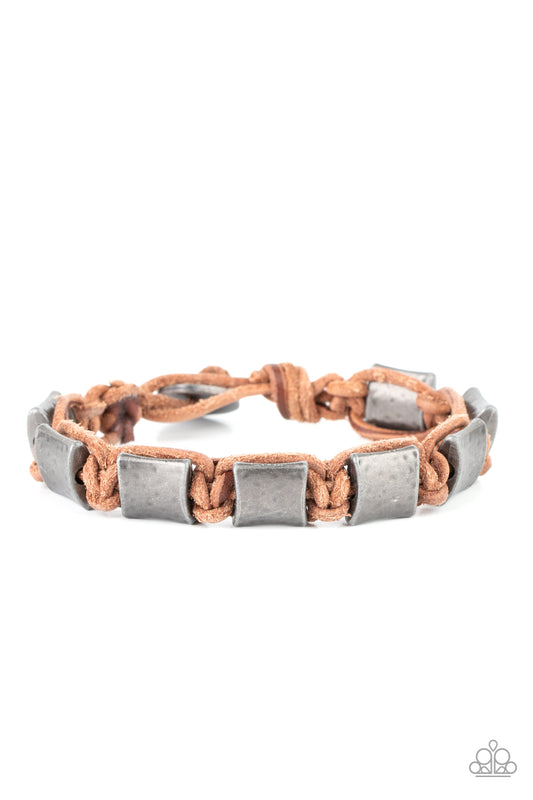 Featuring a hammered finish, a collection of tin-finished silver accents are knotted in place with brown cording around the wrist for a rugged look. Features a button loop closure.  Sold as one individual bracelet.
