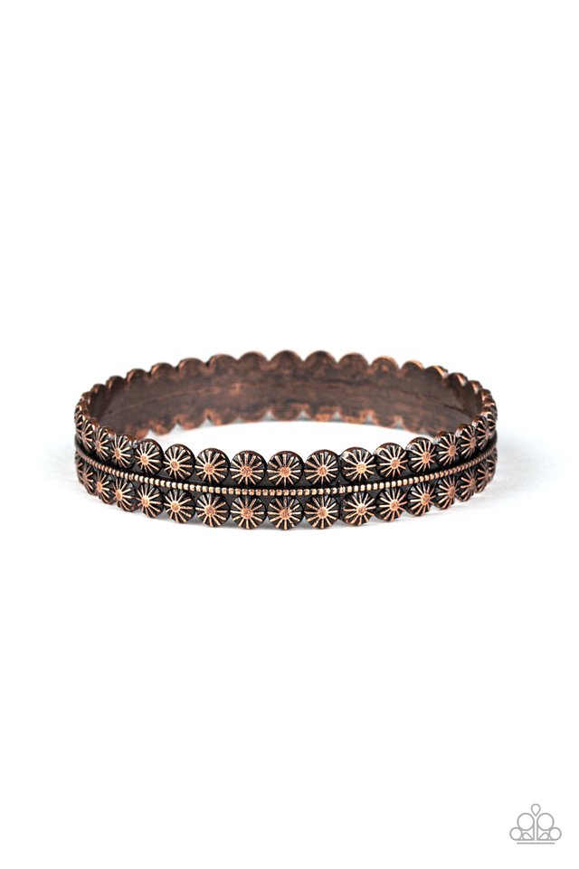 Brushed in an aged finish, an ornately studded copper bangle encircles the wrist as a gorgeous rustic accent.  Sold as one individual.