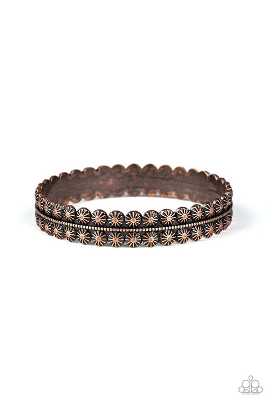 Brushed in an aged finish, an ornately studded copper bangle encircles the wrist as a gorgeous rustic accent.  Sold as one individual.