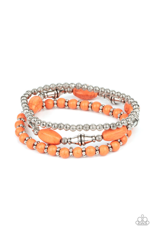 An earthy collection of mismatched orange stones and ornate silver beads are threaded along stretchy bands around the wrist for a colorful artisan flair.  Sold as one set of three bracelets.
