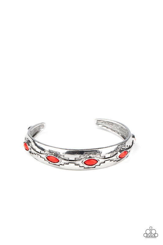 Stamped in southwestern inspired patterns, a dainty silver cuff is dotted with faceted red beads.  Sold as one individual bracelet.