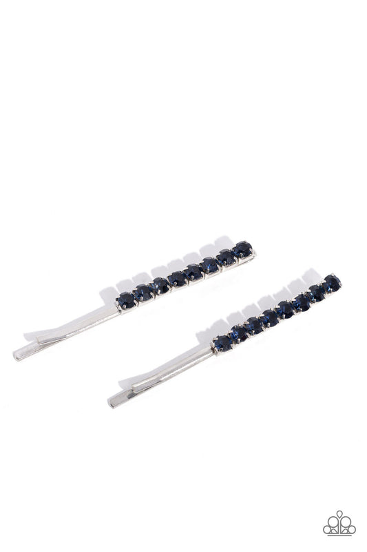 Sparkly rows of glittery blue rhinestones embellish the fronts of two silver bobby pins, creating a glamorous duo.  Sold as one pair of decorative bobby pins.