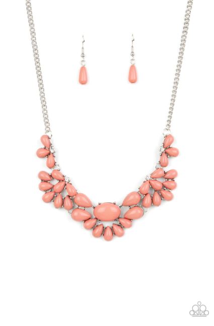 Teardrop Pale Rosette beads fan out from the bottoms of solitaire white rhinestones as they link below the collar, creating whimsically stacked frames. Featuring an oval center, oversized teardrop beads flare out from the centermost frame for a flirtatiously floral finish. Features an adjustable clasp closure.  Sold as one individual necklace. Includes one pair of matching earrings.
