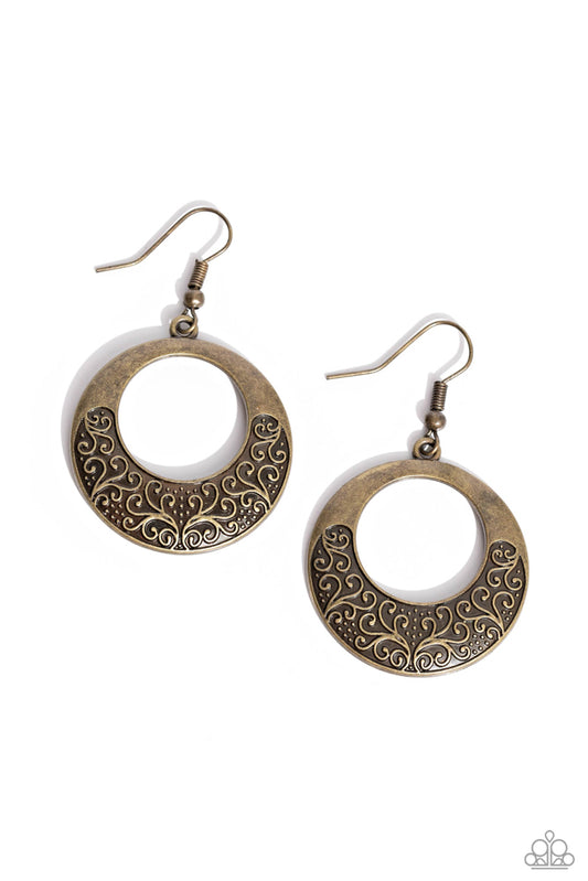 Infused with brass studs, frilly vine-like filigree whirls out across the bottom of a brass hoop for a seasonal shimmer.&nbsp; &nbsp;Earrings attaches to a standard fishhook fitting.  Sold as one pair of earrings.